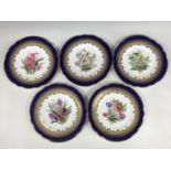 A late 19th Century porcelain botanical dessert service, comprising comport and eight plates, each
