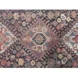 An antique woven Persian Shiraz type rug, 240 x 132 cm