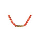 White dyed coral and gold necklace