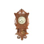 Modernist carved oak wood wall clock, early 20th century
