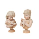 European polychrome bisque pair of girls busts, early 20th century