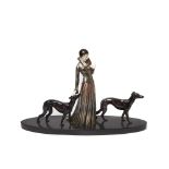 European patinated and enamelled calamine Art Deco style woman with dogs group