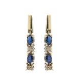 White gold, diamonds and blue sapphires earrings