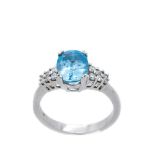 White gold, blue topaz and diamonds ring