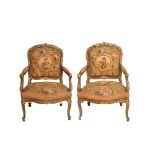 Carved, painted and gilt wood with "petit point" upholstery pair of armchairs, early 20th century