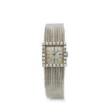 Reloj Omega de pulsera para señora en oro blanco y bisel con diamantes talla brillante. Esfera