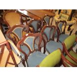 Set of six Victorian mahogany and upholstered balloon back dining chairs on cabriole front supports