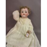 Armand Marseille 990 bisque headed character doll with sleeping eyes and open mouth with two teeth