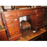 Late Victorian walnut twin pedestal desk with a green leather inset top above nine drawers on