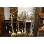 Set of four modern glass and gilt metal mounted Corinthian column table lamps with four unused