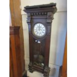 Vienna oak cased wall clock of ornate architectural form,