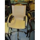 Modern chrome and white upholstered swivel office armchair,