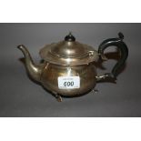 London silver teapot with ebonised handle on low shaped supports (makers mark R.P.