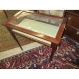 Reproduction mahogany line inlaid bijouterie table having bevelled glass top raised on square