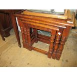 Nest of three green oak rectangular coffee tables on baluster turned supports with stretchers