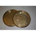 Two circular brass Benares type trays