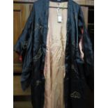 Chinese black silk robe with embroidered dragon decoration