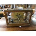 Smiths Sectric Westminster chime mantel clock in an oak glazed case, 13.