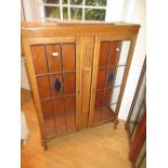 1930's Oak two door leaded glass display cabinet