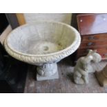 Large cast concrete and white painted circular garden planter,