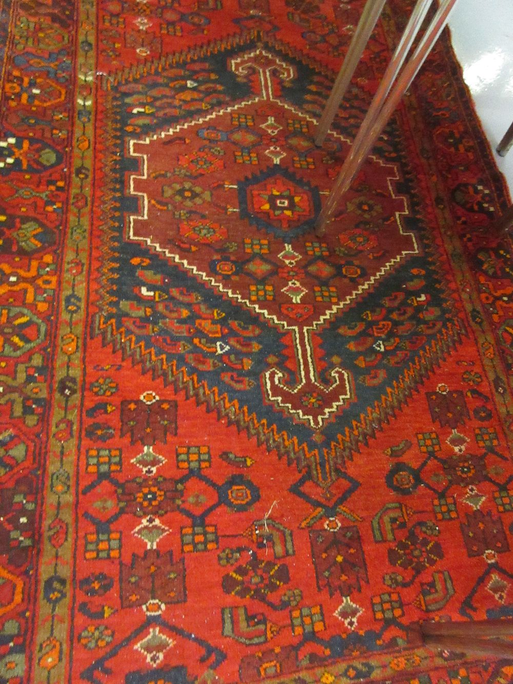 Hamadan rug with a lobed medallion on red ground