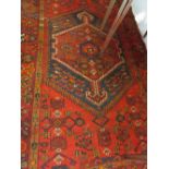 Hamadan rug with a lobed medallion on red ground