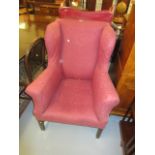 19th Century upholstered wing armchair in 18th Century style raised on square cut chamfered front