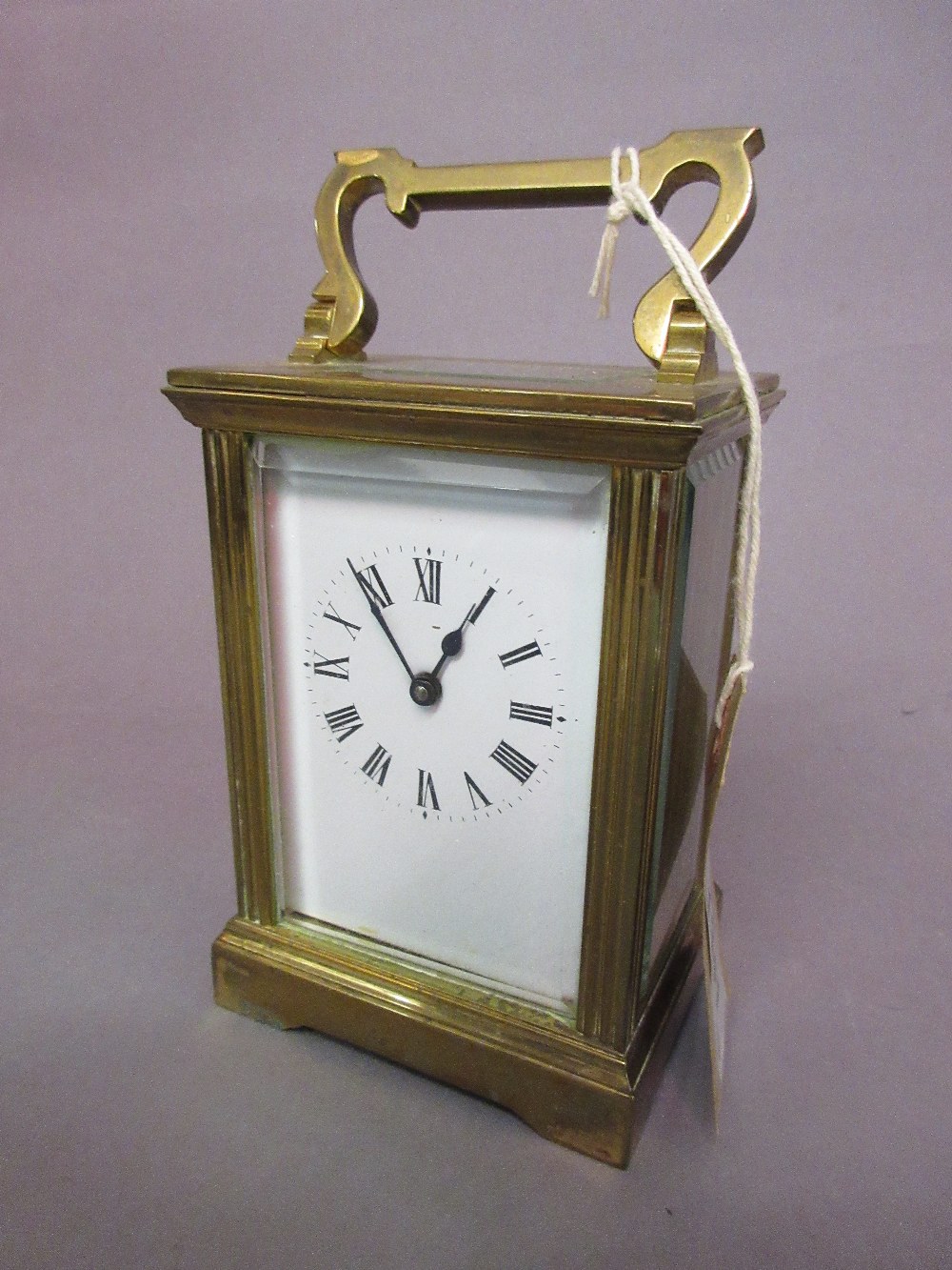 Small brass cased carriage clock with a single train movement,