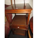 Pair of reproduction rectangular mahogany coffee tables with pull-out slides and canework undertier