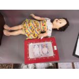 1950's Talking doll together with a boxed doll in a wicker basket