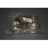 Group of five silver napkin rings