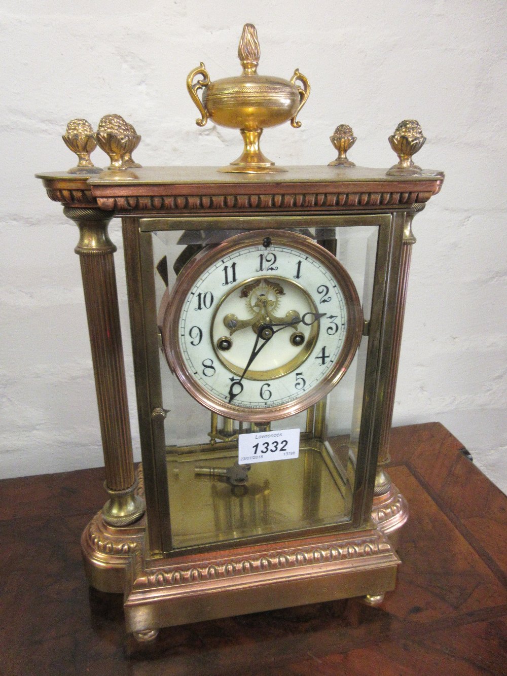 Late 19th or early 20th Century gilt brass four glass library clock with enamel dial,