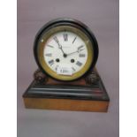 Victorian walnut and part ebonised drum form mantel clock, the enamel dial with Roman numerals,