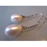 Pair of 18ct white gold pear drop pearl and diamond earrings