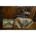 Art Deco marble and onyx three piece clock garniture surmounted with a patinated bronze figure of a