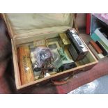 Brown suitcase containing a miscellaneous quantity of items including World War II related