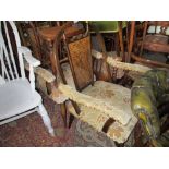 Pair of 20th Century oak cane back open elbow chairs on turned tapering supports