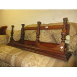 Edwardian walnut shelf bracket with a mirrored back and baluster turned uprights