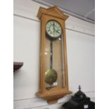Vienna single train weight driven wall clock in a later pine case