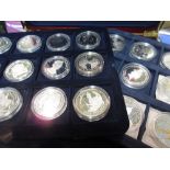 Four silver proof one pound coins, four similar two pound coins,