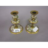 Pair of French champlevé enamel and gilt bronze dwarf candlesticks