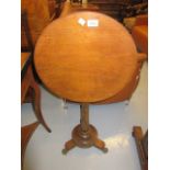 19th Century circular tilt top table on brass paw feet and a 19th Century rosewood two division tea