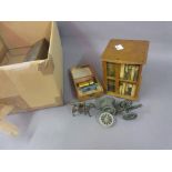 Miniature revolving bookcase containing books, boxed set of dominoes,