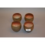 Set of four 20th Century Art Pottery beakers,