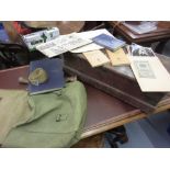 Pine tool box and a green canvas military bag with a quantity of various World War II books and