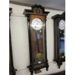 Vienna walnut and ebonised wall clock,