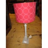 Wooden grey painted table lamp base with red shade,