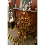 Pair of large Victorian gilt patinated metal candelabra formed as flowers in a vase