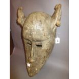 Native carved wooden and patinated face mask,