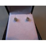 Pair of 18ct white gold diamond solitaire stud earrings, approximately 0.